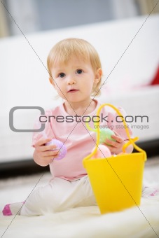 Kid gathering Easter eggs in basket