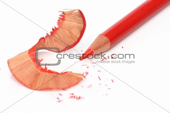 Recently sharpened red pencil over white