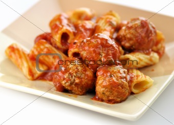 Rigatoni with tomato sauce and meatballs. 