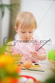 Color smeared baby painting Easter egg
