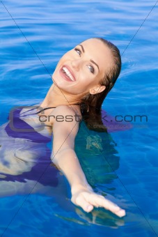Beautiful Woman Relaxing In Pool