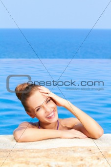 Cute in swimming pool with copy space