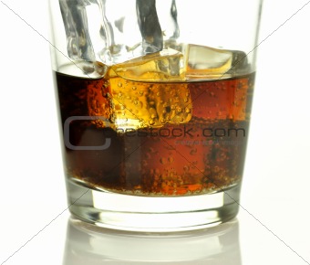 glass of cola with ice cubes