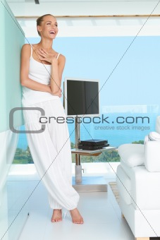 Woman laughing in modern living-room