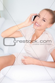 Woman laughing with friends over a mobile