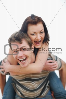 Young woman piggybacking boyfriend