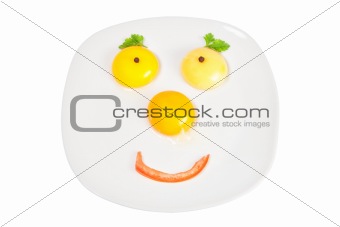 Raw eggs in a bowl in the shape of the face.