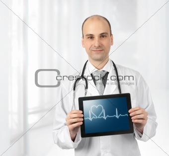 Smiling doctor with hearts beat diagram on a tablet computer