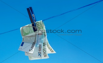 euro money banknotes hanging on clothesline