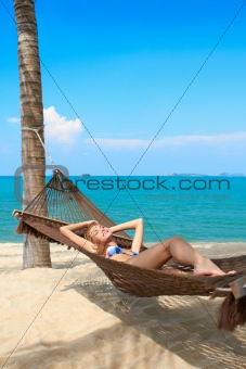 Woman enjoying the serenity of a tropical beach