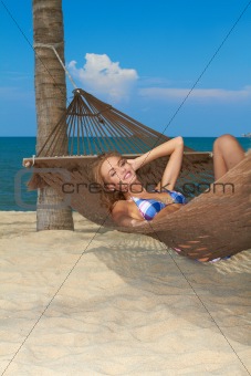 Woman enjoying the peace of a tropical beach