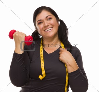 Attractive Hispanic Woman with Tape Measure Lifting Dumbbell Against a White Background.