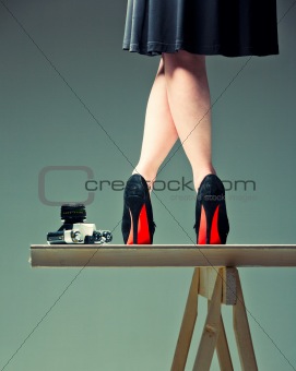 woman's legs and the camera