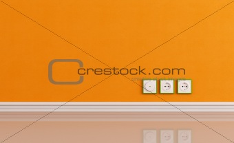 Wall outlets on the orange wall