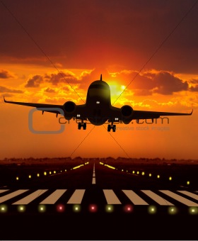 airplane take off during sunset