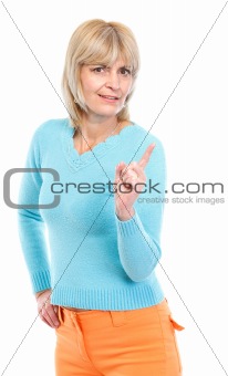 Middle age woman threatening finger