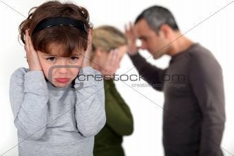 couple having a quarrel in front of their little girl