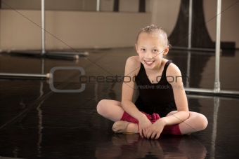 Happy Ballerina Sitting on Floor