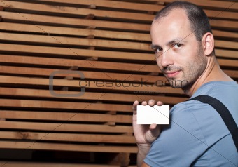 Craftsman holding a business card