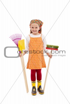 Happy spring girl with gardening tools