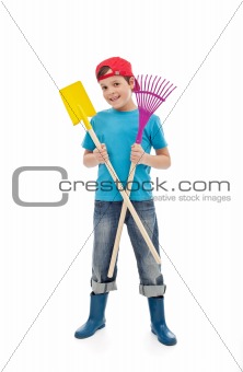 Happy boy with gardening tools