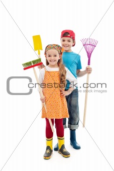 Happy gardener kids - with tools and rubber boots