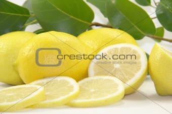 Fresh juicy lemons with leaves