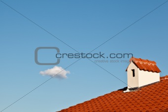 Beautiful Cloud and Dormer Window with Red Tiled Roof
