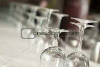Several Drinking Glasses Abstract in Formal Dining Room Setting.