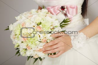 bouquet in the hands of the bride