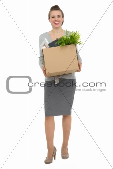 Full length portrait of happy woman employee with box with personal items