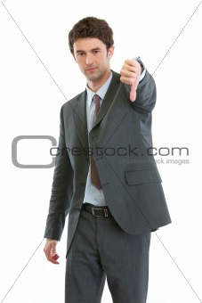 Modern businessman showing thumbs down