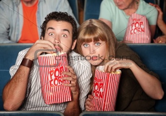 Captivated Couple in Theater