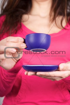 pink sweater woman drinking coffe
