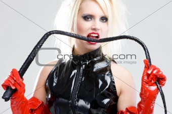 woman in latex with whip