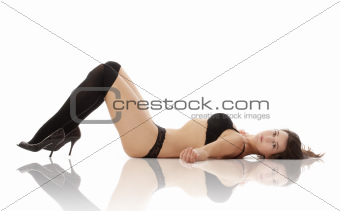 beautiful young woman in black underwear and stockings - isolated on white