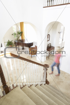 House Interior Showing Staircase And Abstract Female Figure