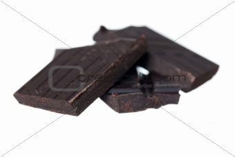 Pile of Dark Chocolate on White Background.