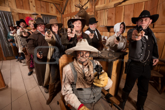 Tough People with Guns in Old Saloon
