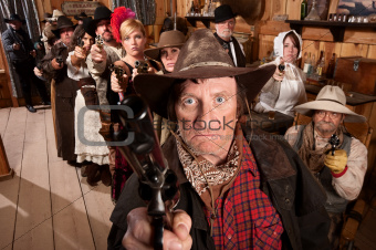 Mean Gunslinger and Customers With Weapons