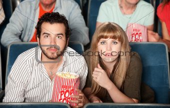 Couple Staring in Theater