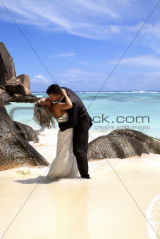 Romantic bridal couple on the beach