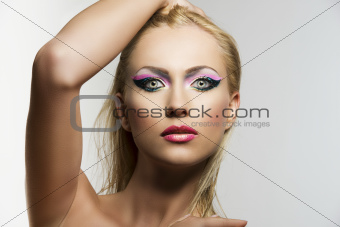 blonde girl's beauty portrait with hand on the head