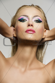 blonde girl's beauty portrait with hands behind the nape