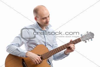 Guitarist playing acoustic guitar isolated on white