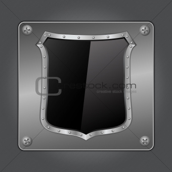 Black shield on metal board
