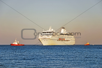 Cruise ship and two tugboats