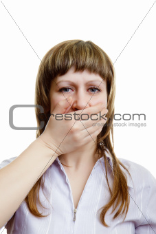 young girl covers her mouth with his hands