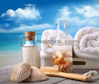 Fluffy towels with bath accessories at the beach