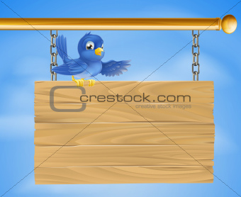 Blue bird on wooden sign